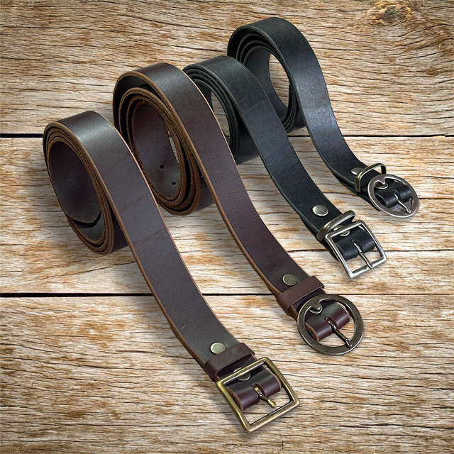 Topanga Creek Outpost leather belts on a wooden table