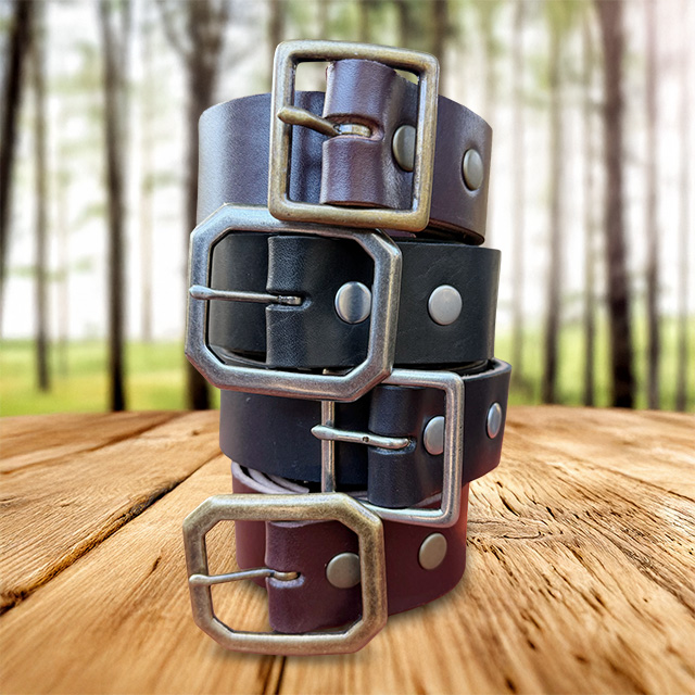 Topanga Creek Outpost leather belts on a wooden table