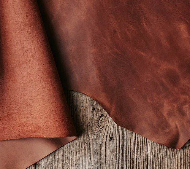 Brown leather hide on wooden table