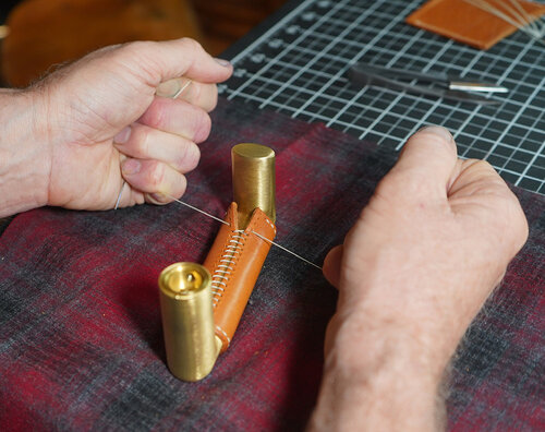 We hand stitched the leather wrap to create a beautiful seam for each door handle