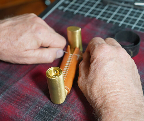 We hand stitched the leather wrap to create a beautiful seam for each door handle