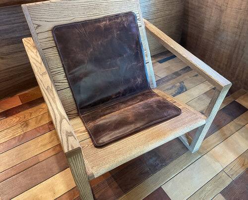 We were commissioned to make a leather seat cushion for Chad Hagerman's wooden chair