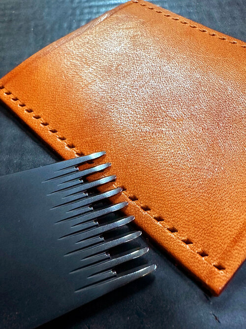 Leather wallet hand punched and ready to be sewn by hand