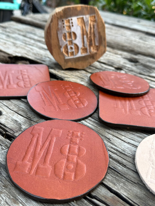 Leather coasters for McCabe's Guitar Shop in Santa Monica
