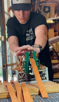 Working with different leather tools at the shop