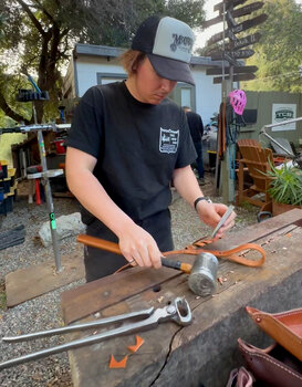 Working with different leather tools at the shop