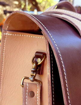 Leather scooter bag can be customized with different leather colors as well as hardware choices