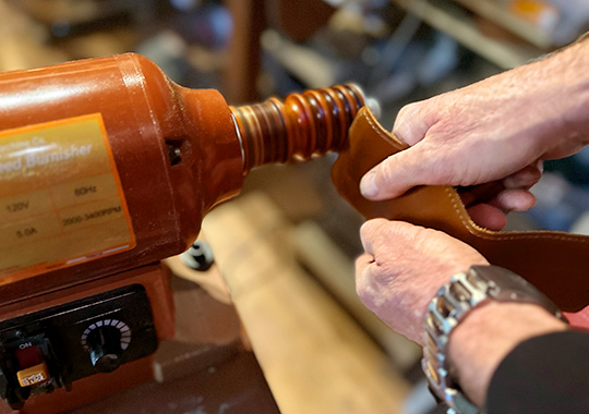 Burnishing the edges of a leather wallet
